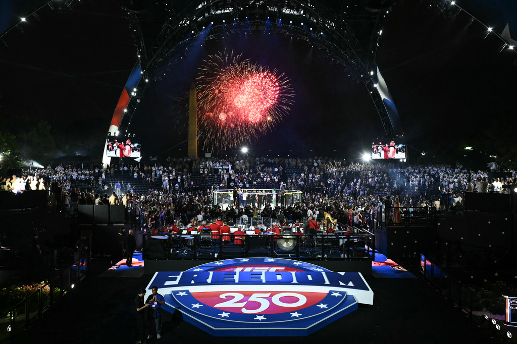 Fireworks go off as Justin Gaethje celebrates after defeating Ilia Topuria in a lightweight title bout during UFC Freedom 250 on the South Lawn of the White House, Monday, June 15, 2026, in Washington. (Saul Loeb/Pool Photo via AP)