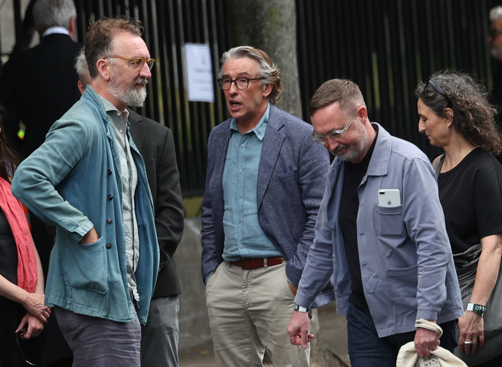 Steve Coogan and Chris O'Dowd arrive for the funeral of Glen Hansard at St Patrick's Cathedral in Dublin, Tuesday, Aug. 4, 2026. (Damien Eagers/PA via AP)
