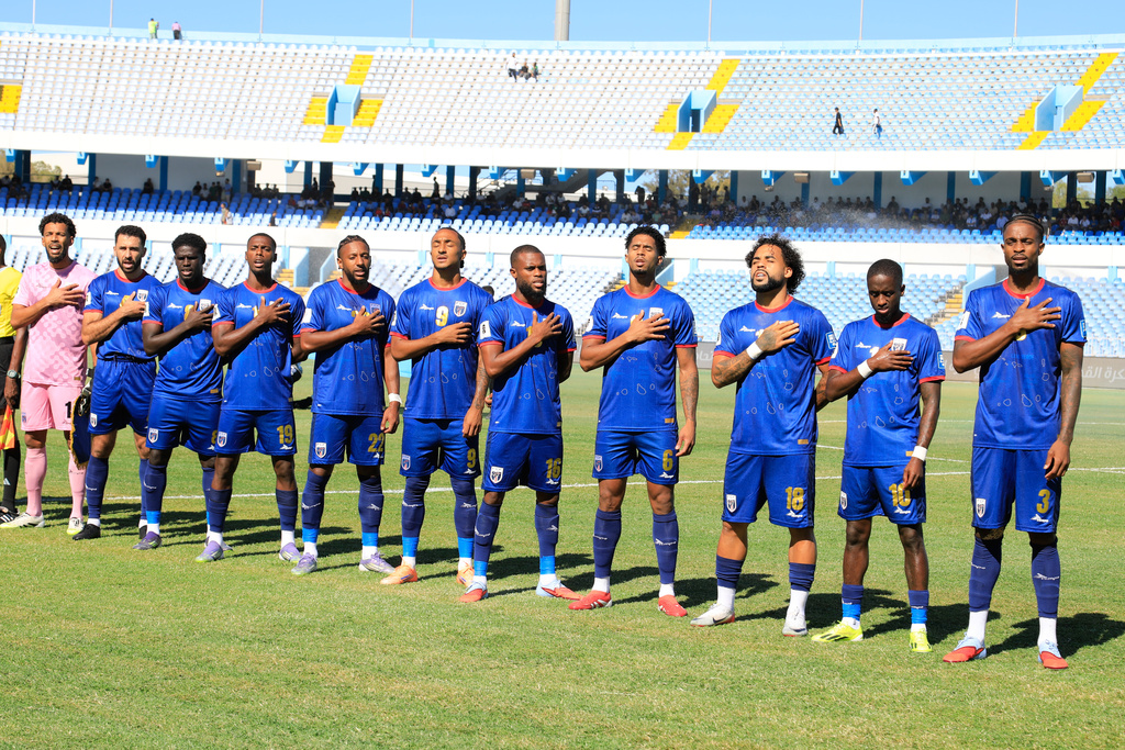 Cape Verde players stand for the national anthem during the World Cup 2026 African qualifier Group D soccer match between Libya and Cape Verde in Tripoli, Libya, Wednesday, Oct. 8, 2025. (AP Photo/Yousef Murad)