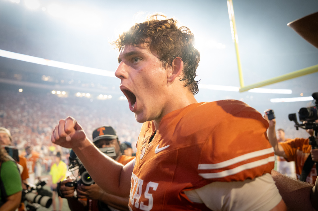 Texas Longhorns quarterback Arch Manning (16) yells as he walks to the locker room after Texas' 24-23 win over Ohio State during an NCAA college football game in Austin, Texas, Saturday, Sept. 12, 2026. (Sara Diggins/The San Antonio Express-News via AP)