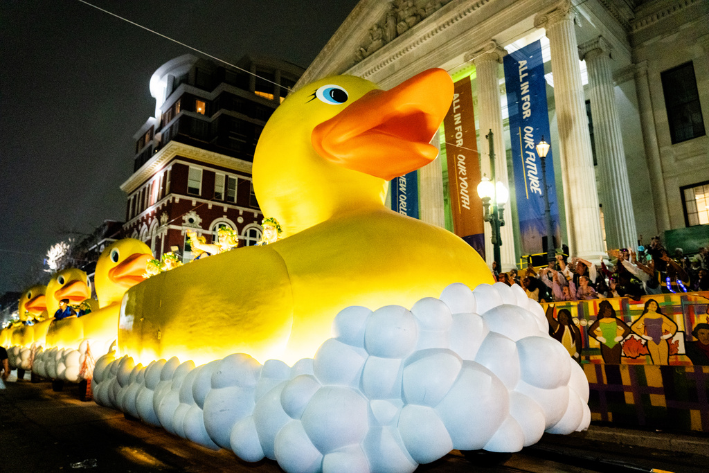 Attendees participate in the annual Krewe of Muses parade during the Mardi Gras season on Thursday, Feb. 12, 2026, in New Orleans. (Photo by Amy Harris/Invision/AP)