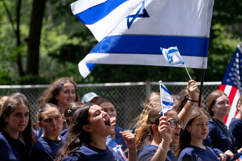 A parade participant cheers on the crowd during the Israel Day Parade, Sunday, May 31, 2026, in New York. (AP Photo/Emil T. Lippe)