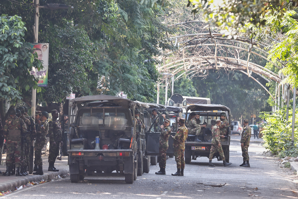 Bangladeshi army soldiers guard outside the demolished residence of Sheikh Mujibur Rahman, Bangladesh's former leader and the father of the country's ousted Prime Minister Sheikh Hasina a day after Hasina was sentenced to death, in Dhaka, Bangladesh, Tuesday, Nov. 18, 2025. (AP Photo/ Rajib Dhar)