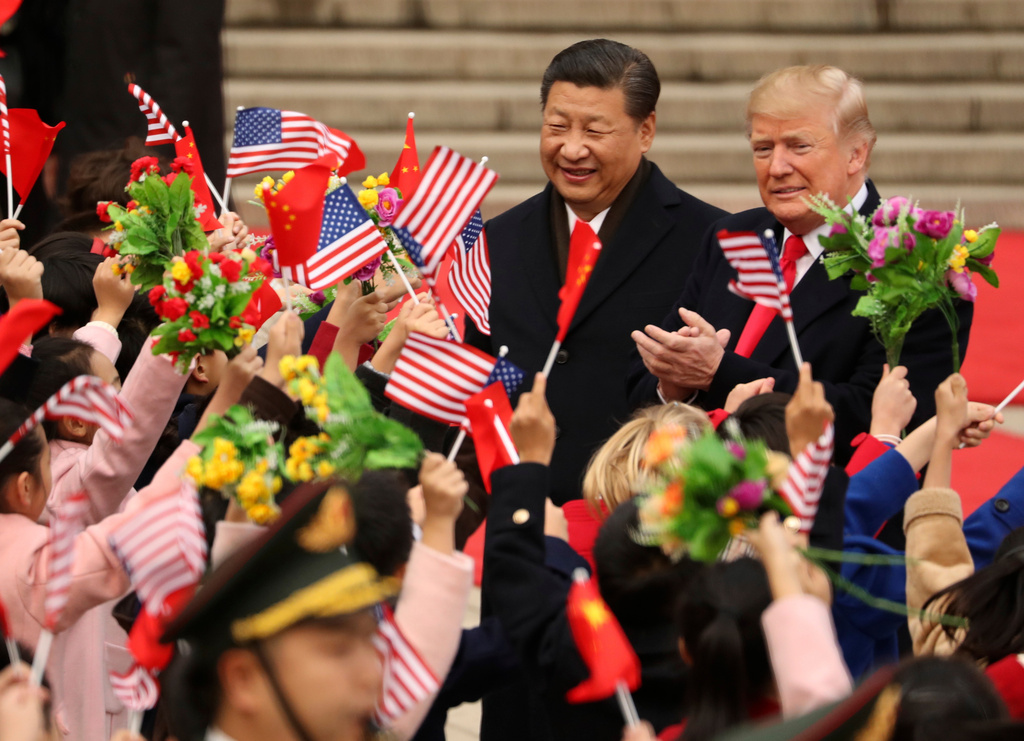 FILE - President Donald Trump and Chinese President Xi Jinping participate in a welcome ceremony at the Great Hall of the People in Beijing, China, Nov. 9, 2017. (AP Photo/Andrew Harnik, File)
