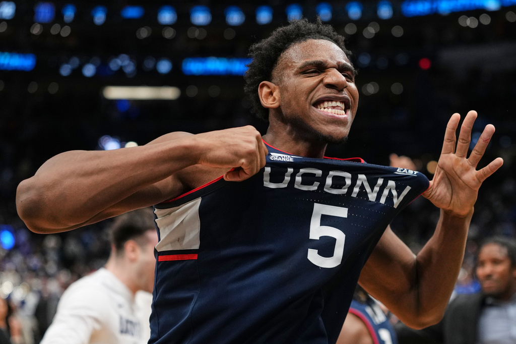 UConn forward Tarris Reed Jr. (5) reacts after the team's win against Duke in the Elite Eight of the NCAA college basketball tournament, Sunday, March 29, 2026, in Washington. (AP Photo/Abbie Parr)