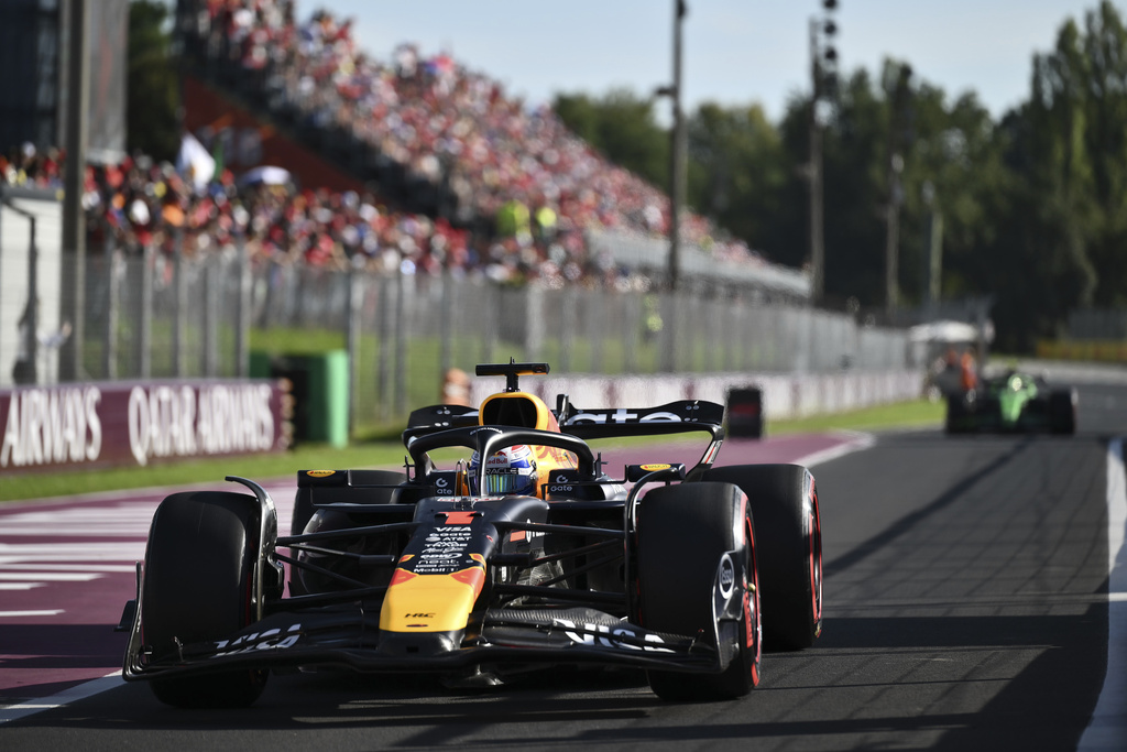 Red Bull driver Max Verstappen of the Netherlands returns to the parc ferme after winning the pole position in the qualifying session ahead of the Italian Grand Prix at the Monza racetrack in Monza, Italy, Saturday, Sept. 6, 2025. (Marco Bertorello/Pool Photo via AP)