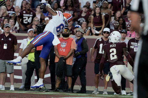 Florida wide receiver Dallas Wilson (6) catches a pass in the end zone for a touchdown as Texas A&M cornerback Dezz Ricks (2) is late to defend during the first half of an NCAA college football game Saturday, Oct. 11, 2025, in College Station, Texas. (AP Photo/Sam Craft) Florida wide receiver Dallas Wilson (6) catches a pass in the end zone for a touchdown as Texas A&M cornerback Dezz Ricks (2) is late to defend during the first half of an NCAA college football game Saturday, Oct. 11, 2025, in College Station, Texas. (AP Photo/Sam Craft)