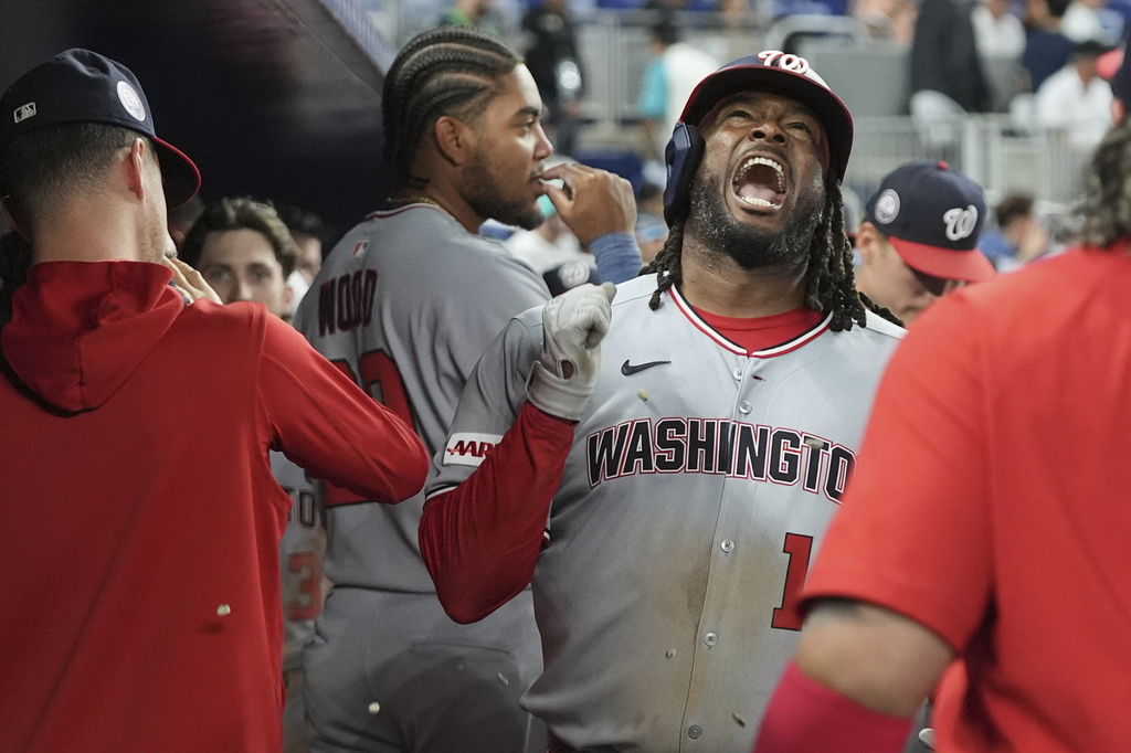 Washington Nationals' Josh Bell (19) reacts after hitting a two run home run during the seventh inning of a baseball game against the Miami Marlins, Monday, Sept. 8, 2025, in Miami. (AP Photo/Lynne Sladky)