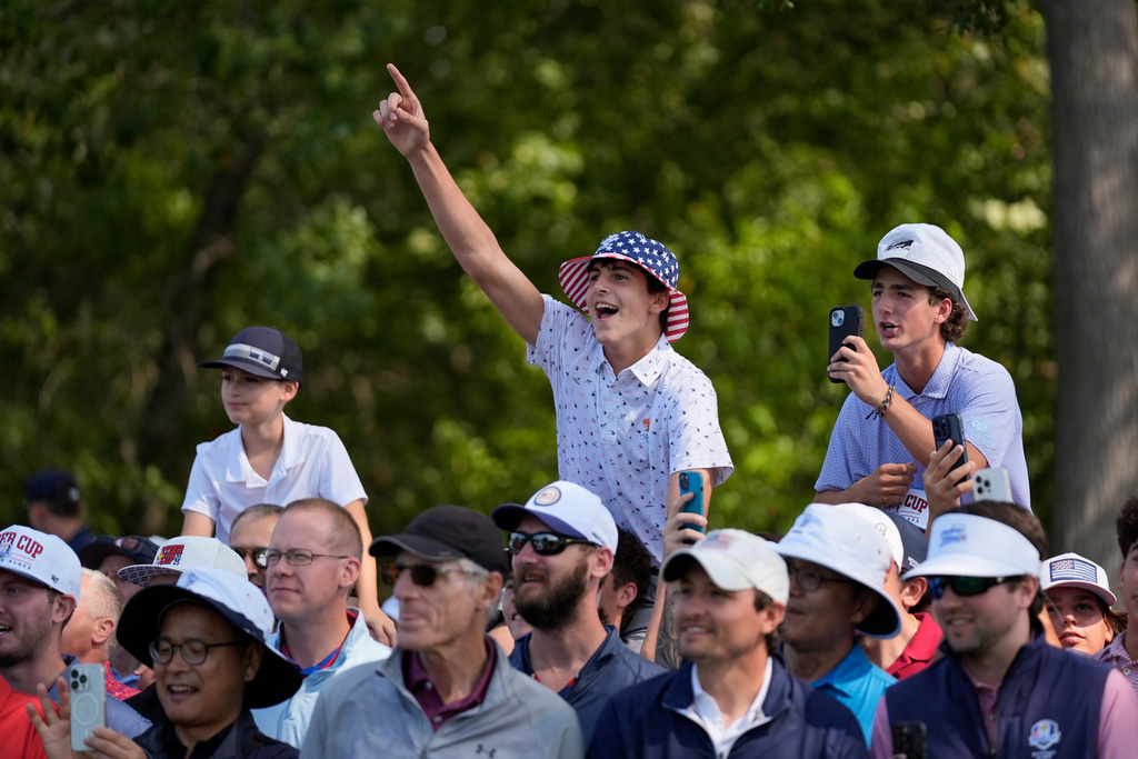 Fans react during a practice round for the Ryder Cup golf tournament, Tuesday, Sept. 23, 2025, in Farmingdale, N.Y., at Bethpage State Park's Black Course. (AP Photo/Robert Bukaty)