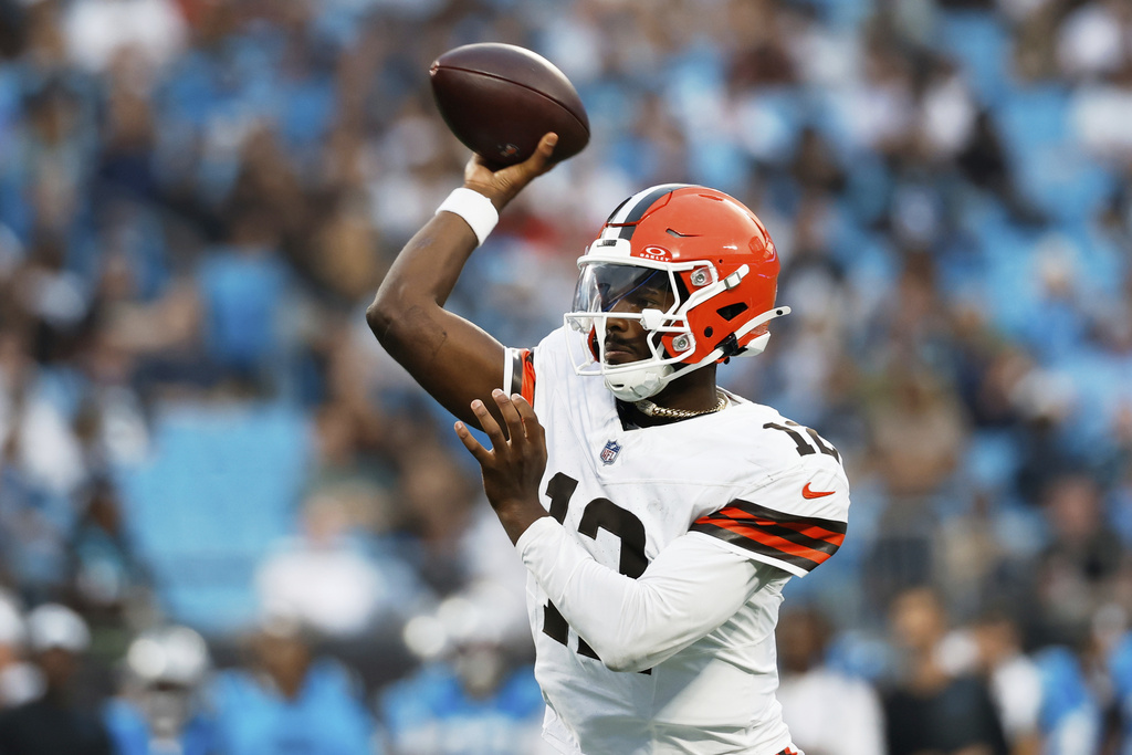 Cleveland Browns quarterback Shedeur Sanders throws his first touchdown pass during the first half of a preseason NFL football game against the Carolina Panthers on Friday, Aug. 8, 2025, in Charlotte, N.C. (AP Photo/Rusty Jones)