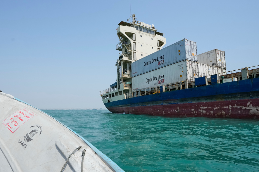 A cargo vessel carrying shipping containers lies anchored in the Strait of Hormuz off Bandar Abbas, Iran, Sunday, Sept. 6, 2026. (AP Photo/Vahid Salemi)
