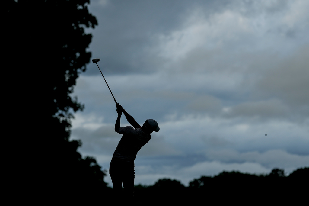 Michael Kim, of South Korea, hits from the 18th tee during first round of the Truist Championship golf tournament at the Quail Hollow Club, Thursday, May 7, 2026, in Charlotte, N.C. (AP Photo/Chris Carlson)d