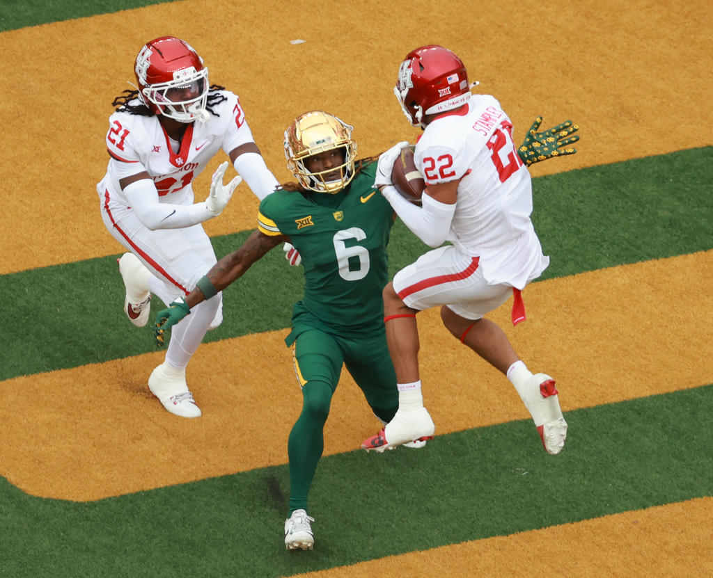 Houston defensive back Marc Stampley II intercepts a pass intended for Baylor wide receiver Ashtyn Hawkins in the first half of an college football game, Saturday, Nov. 29, 2025, in Waco, Texas. (Rod Aydelotte/Waco Tribune-Herald via AP)