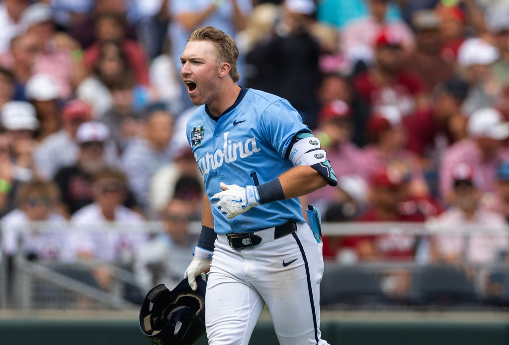 North Carolina's Cooper Nicholson celebrates after hitting a two-run home run against Oklahoma in the seventh inning of Game 2 of the NCAA College World Series baseball finals in Omaha, Neb., Sunday, June 21, 2026. (AP Photo/Rebecca S. Gratz)