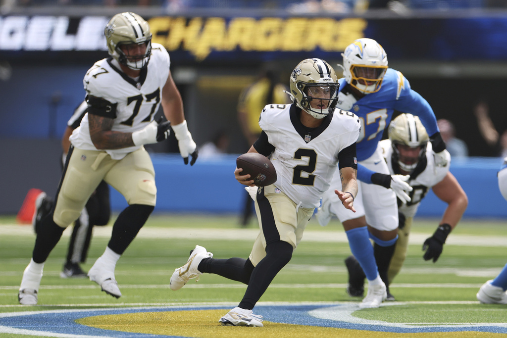 New Orleans Saints quarterback Spencer Rattler (2) runs against the Los Angeles Chargers during the first half of a preseason NFL football game Sunday, Aug. 10, 2025, in Inglewood, Calif. (AP Photo/Eric Thayer)