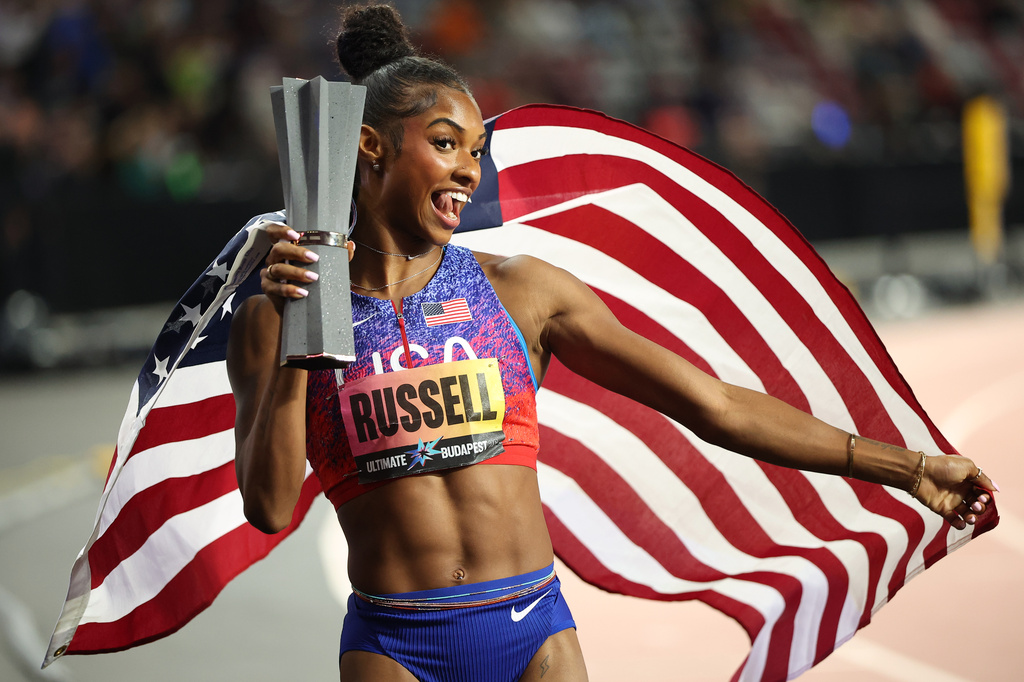 Masai Russell, of the United States, celebrates winning the women's 100 meters hurdles final during the World Athletics Ultimate Championship in Budapest, Hungary, Friday, Sept. 11, 2026. (AP Photo/Armin Durgut)