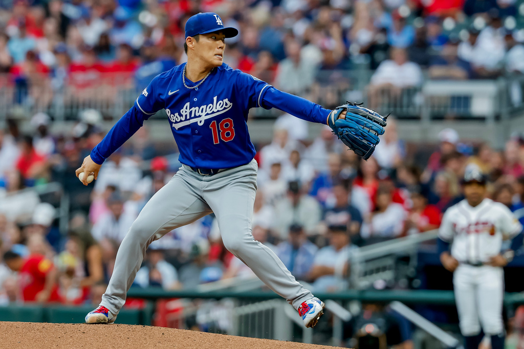 Los Angeles Dodgers pitcher Yoshinobu Yamamoto delivers to an Atlanta Braves batter during the first inning of a baseball game, Thursday, Aug. 27, 2026, in Atlanta. (AP Photo/Erik S. Lesser)
