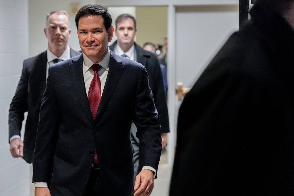Secretary of State Marco Rubio walks to a secure room in the basement of the Capitol to brief senators on military strikes near Venezuela, Tuesday, Dec. 16, 2025, in Washington. (AP Photo/Julia Demaree Nikhinson)