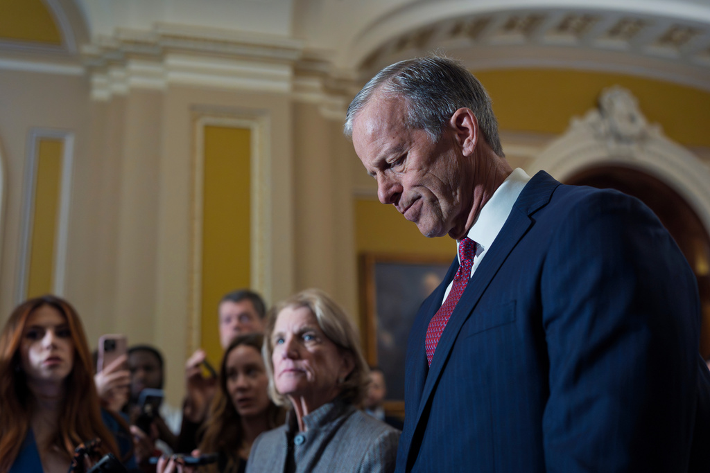 With a partial government shutdown looming by week's end, Senate Majority Leader John Thune, R-S.D., and Sen. Shelly Moore Capito, R-W.Va., face reporters following a closed-door meeting with fellow Republicans on spending legislation that funds the Department of Homeland Security and a swath of other government agencies as the country reels from the deaths of two people at the hands of federal agents in Minneapolis, at the Capitol in Washington, Wednesday, Jan. 28, 2026. (AP Photo/J. Scott Applewhite)