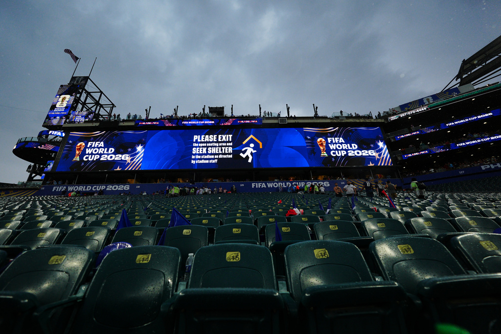 A sign advising fans of a weather delay is displayed during the World Cup Group I soccer match between France and Iraq in Philadelphia, Monday, June 22, 2026. (AP Photo/Derik Hamilton)