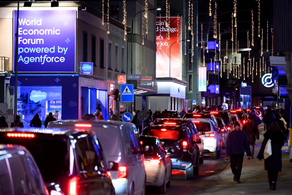Cars are stuck in a traffic jam on the Promenade street prior to the annual meeting of the World Economic Forum in Davos, Switzerland, Monday, Jan. 19, 2026. (Laurent Gillieron/Keystone via AP)