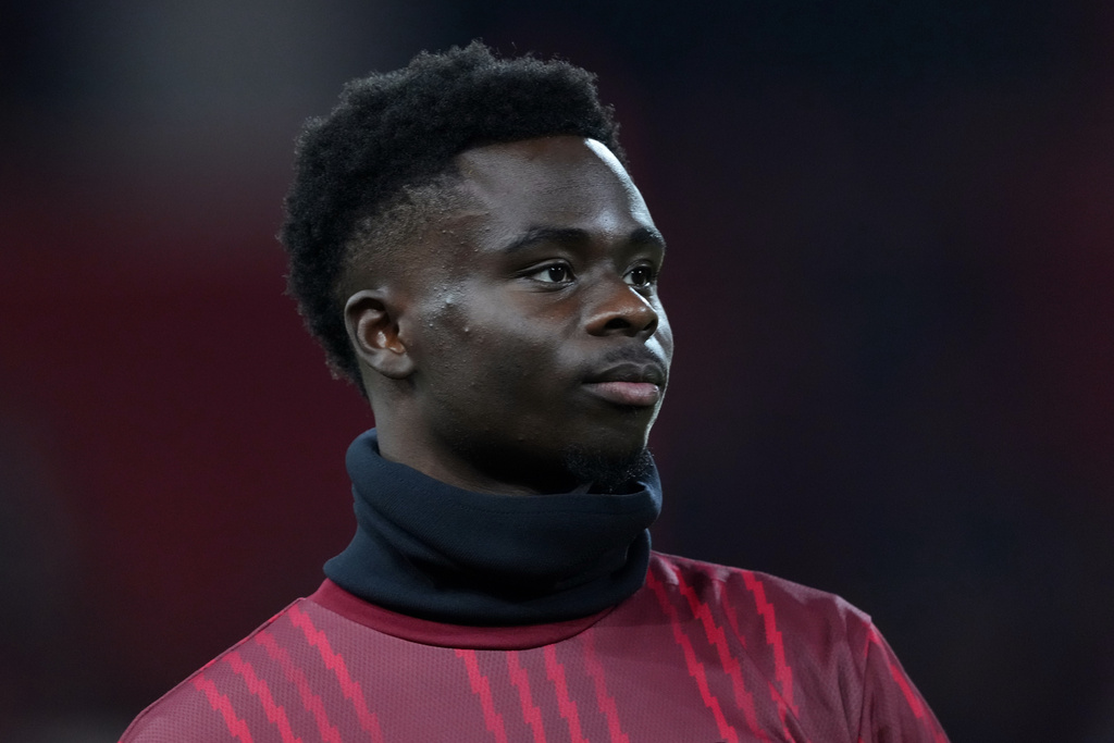 Arsenal's Bukayo Saka stands on the pitch during warmup before the English Premier League soccer match between Nottingham Forest and Arsenal in Nottingham, England, Saturday, Jan. 17, 2026. (AP Photo/Dave Shopland)