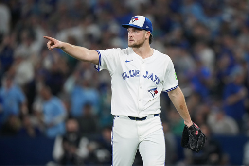 Toronto Blue Jays pitcher Trey Yesavage reacts after a fifth inning-ending double play in Game 6 of baseball's American League Championship Series against the Seattle Mariners in Toronto, Sunday, Oct. 19, 2025. (Nathan Denette/The Canadian Press via AP) Toronto Blue Jays pitcher Trey Yesavage reacts after a fifth inning-ending double play in Game 6 of baseball's American League Championship Series against the Seattle Mariners in Toronto, Sunday, Oct. 19, 2025. (Nathan Denette/The Canadian Press via AP)
