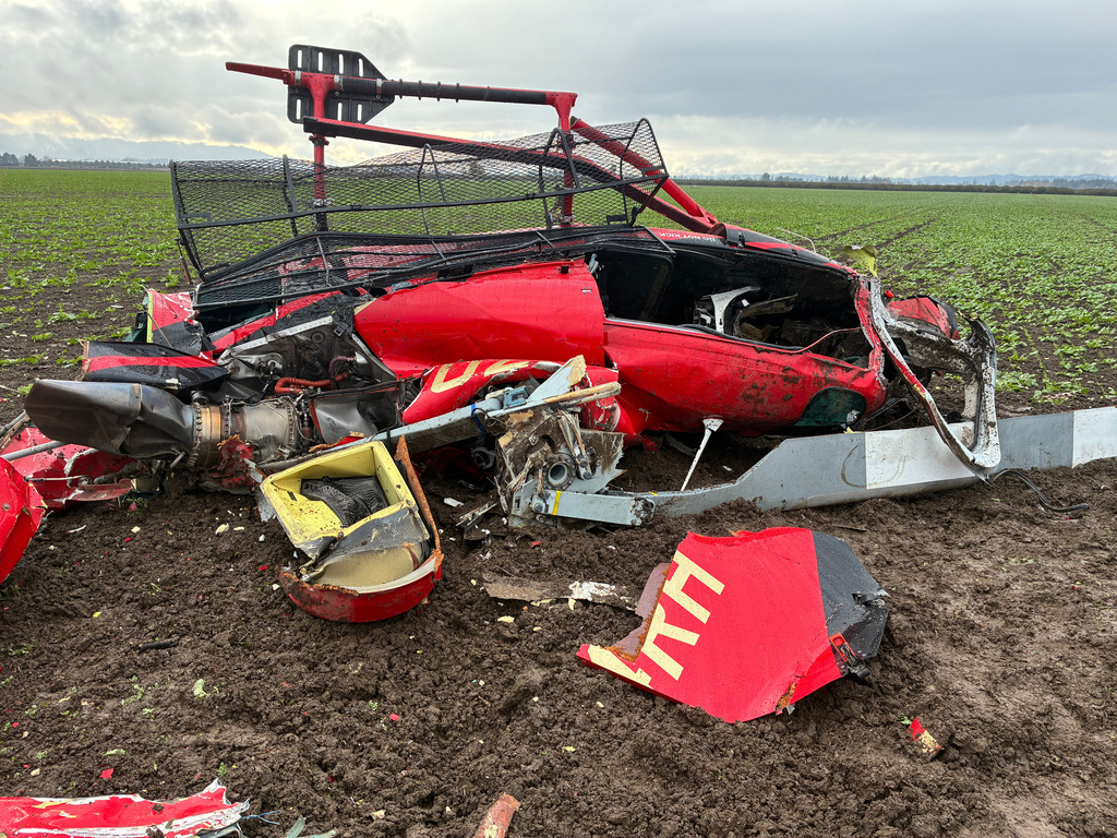 This photo released by the Yamhill County Sheriff's Office shows a damaged helicopter after two helicopters collided and crashed into a farm field in Yamhill County, Ore., Thursday, Oct. 29, 2026. (Yamhill County Sheriff's Office via AP)