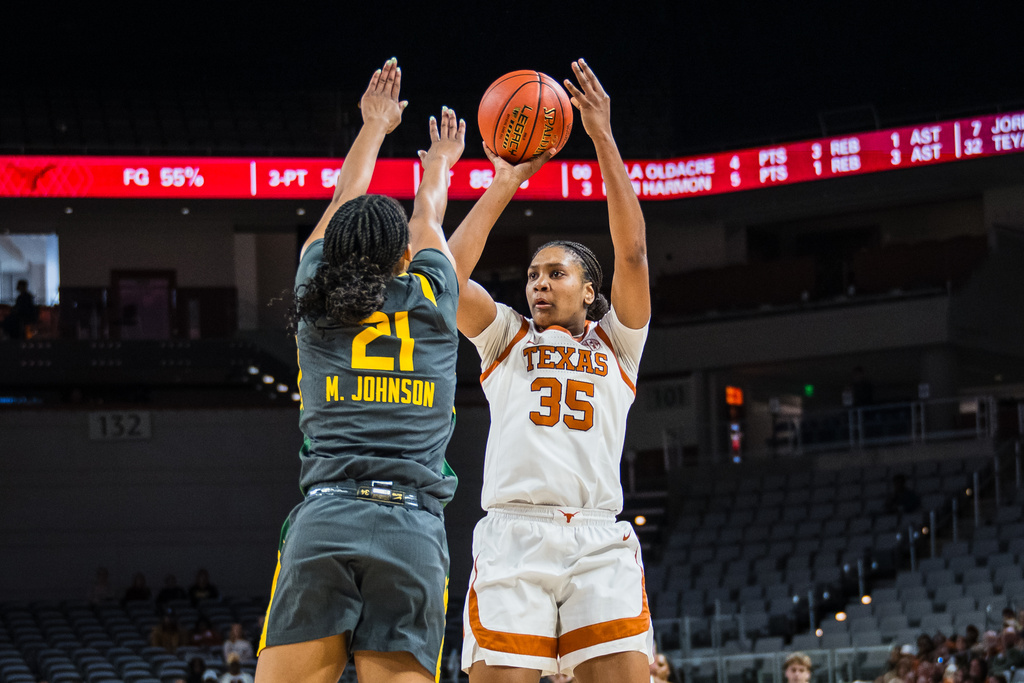 Texas forward Madison Booker (35) looks to shoot during an NCAA college basketball game against Baylor, Sunday, Dec. 14, 2025, Fort Worth, Texas. (AP Photo/Jessica Tobias)
