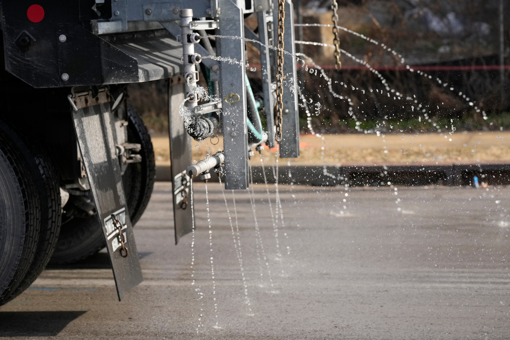 A Nashville Department of Transportation truck applies salt brine to a roadway Thursday, Jan. 22, 2026, in Nashville, Tenn. ahead of a winter storm expected to hit the state over the weekend. (AP Photo/George Walker IV)