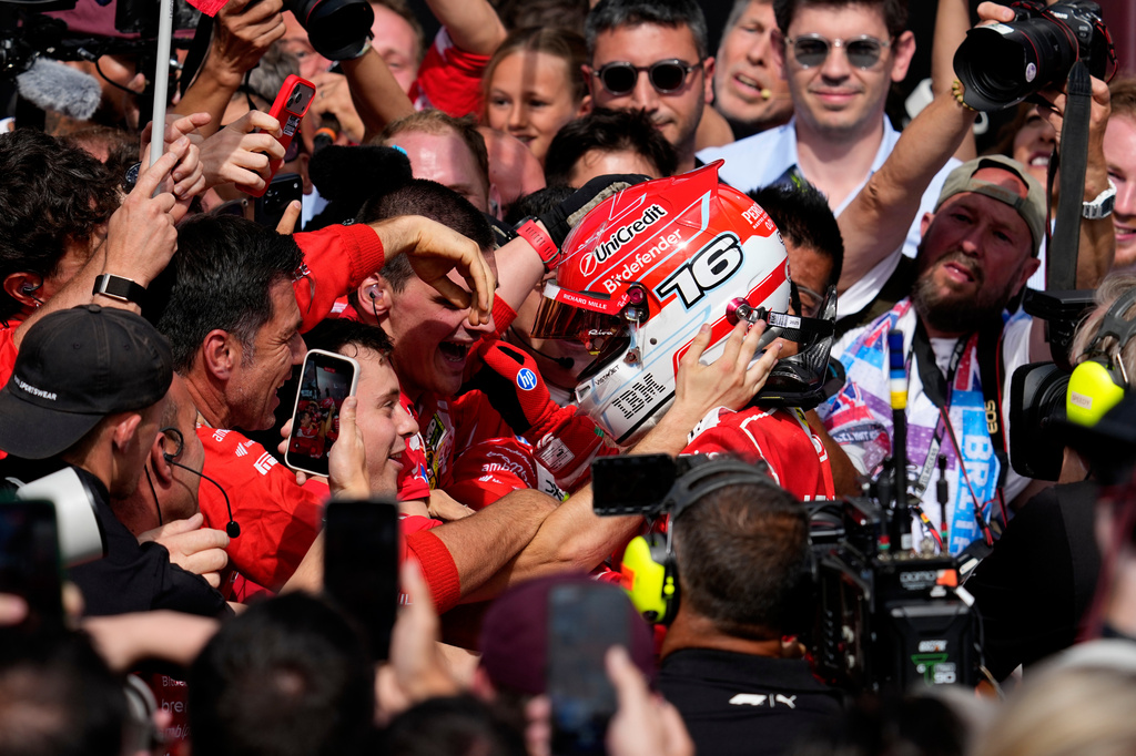 Ferrari driver Charles Leclerc of Monaco celebrates with his team after winning the British F1 Grand Prix, in Silverstone, England, Sunday, July 5, 2026. (AP Photo/Darko Bandic)