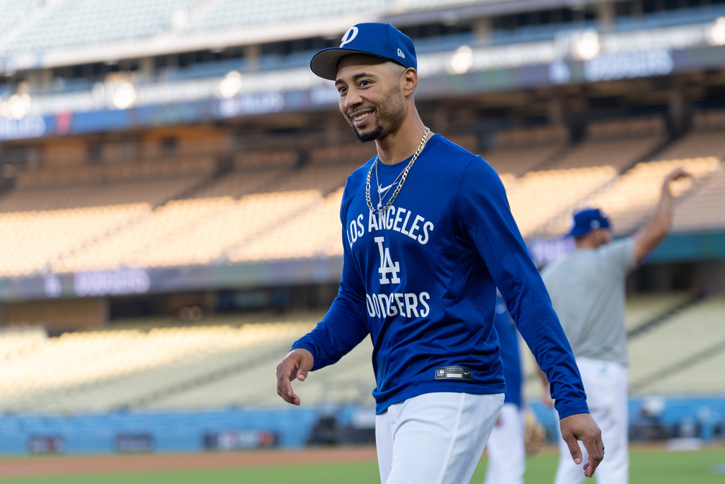 Los Angeles Dodgers' Mookie Betts walks across the field during practice Tuesday, Oct. 7, 2025, in Los Angeles, the day before Game 3 of baseball's National League Division Series against the Philadelphia Phillies. (AP Photo/Jae C. Hong)