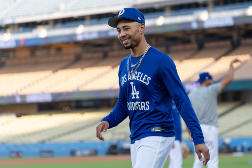Los Angeles Dodgers' Mookie Betts walks across the field during practice Tuesday, Oct. 7, 2025, in Los Angeles, the day before Game 3 of baseball's National League Division Series against the Philadelphia Phillies. (AP Photo/Jae C. Hong) Los Angeles Dodgers' Mookie Betts walks across the field during practice Tuesday, Oct. 7, 2025, in Los Angeles, the day before Game 3 of baseball's National League Division Series against the Philadelphia Phillies. (AP Photo/Jae C. Hong)