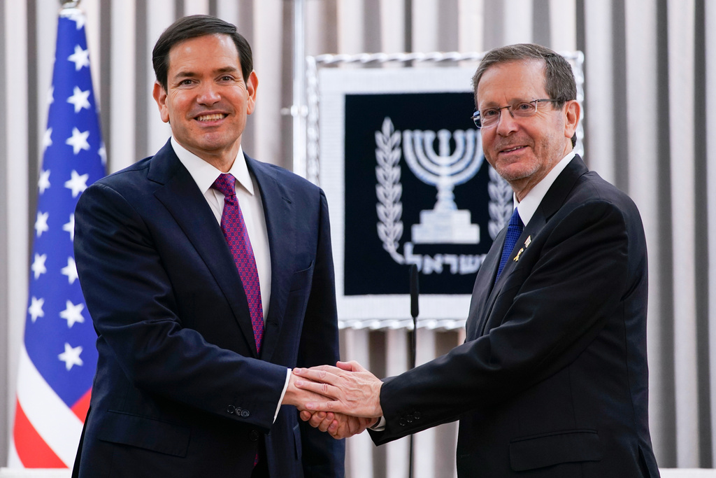 U.S. Secretary of State Marco Rubio and Israeli President Isaac Herzog shake hands ahead of a meeting at the Beit Hanassi presidential residence, during Rubio's visit, in Jerusalem, Monday, Sept. 15, 2025. (Nathan Howard/Pool Photo via AP)