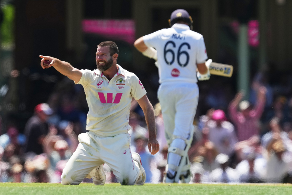 Australia's Michael Neser celebrates after dismissing England's Joe Root during play on day two of the fifth and final Ashes cricket test between England and Australia in Sydney, Monday, Jan. 5, 2026. (AP Photo/Mark Baker)
