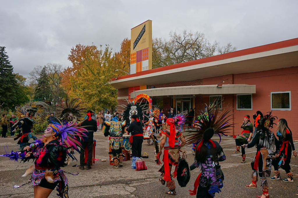 Members of Aztec dance groups perform during a commemoration of Día de Muertos (Day of the Dead) outside El Colegio High School in Minneapolis on Saturday, Nov. 1, 2025. (AP Photo/Giovanna Dell'Orto)