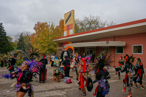 Members of Aztec dance groups perform during a commemoration of Día de Muertos (Day of the Dead) outside El Colegio High School in Minneapolis on Saturday, Nov. 1, 2025. (AP Photo/Giovanna Dell'Orto) Members of Aztec dance groups perform during a commemoration of Día de Muertos (Day of the Dead) outside El Colegio High School in Minneapolis on Saturday, Nov. 1, 2025. (AP Photo/Giovanna Dell'Orto)