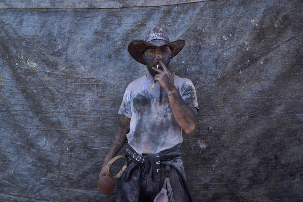 Stamatis Ioannou, aged 25, poses for a photograph as he participates in the annual flour war marking the end of the Carnival season on Clean Monday in Galaxidi, about 200 kilometers (120 miles) west of Athens, Monday Feb. 23, 2026, at the start of the 40-day Christian Lent fast leading to Easter. (AP Photo/Petros Giannakouris)