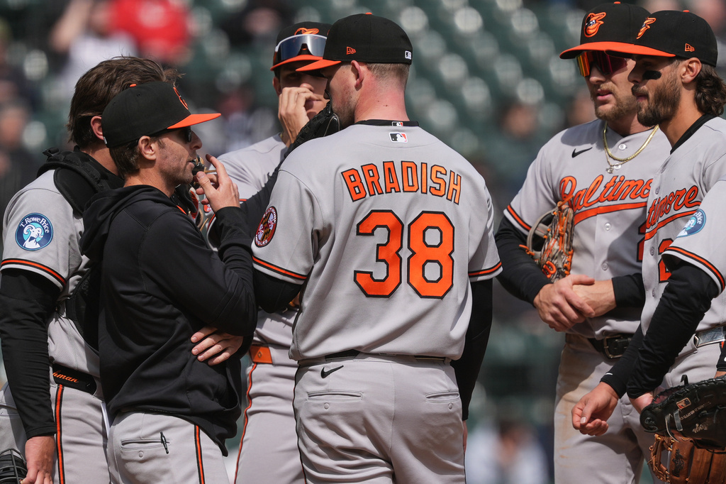 Baltimore Orioles manager Craig Albernaz, left, talks with starting pitcher Kyle Bradish during the fifth inning of a baseball game against the Chicago White Sox in Chicago, Wednesday, April 8, 2026. (AP Photo/Nam Y. Huh)
