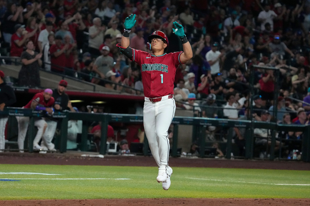 Arizona Diamondbacks' Jorge Barrosa (1) celebrates his two-run home run against the Minnesota Twins in the fifth inning of a baseball game Saturday, June 20, 2026, in Phoenix. (AP Photo/Darryl Webb)