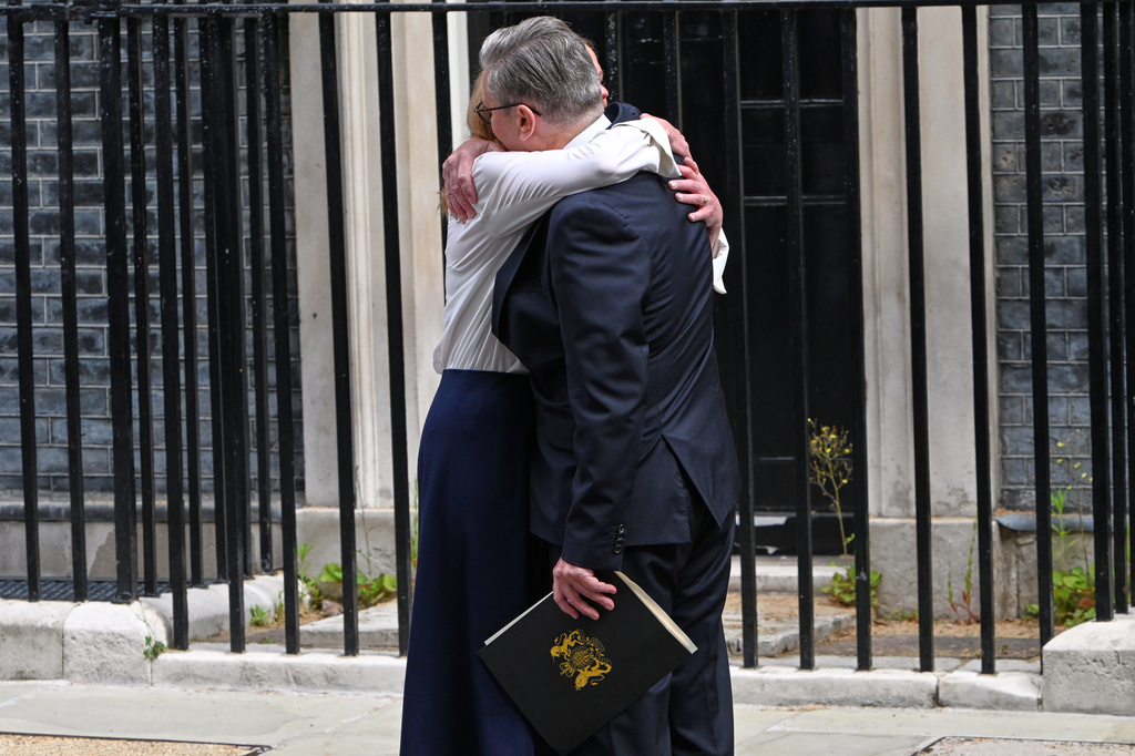 Britain's Prime Minister Keir Starmer hugs his wife Victoria after he announced his resignation outside 10 Downing Street in London, Monday, June 22, 2026.AP Photo/Thomas Krych)