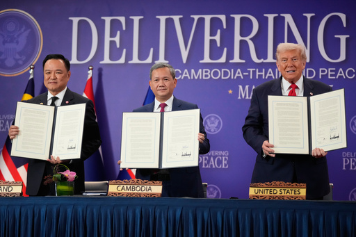 President Donald Trump, Cambodian Prime Minister Hun Manet, left, and Thailand's Prime Minister Anutin Charnvirakul pose with their documents during a signing ceremony on the sidelines of the ASEAN Summit in Kuala Lumpur, Malaysia, Sunday, Oct. 26, 2025. (AP Photo/Mark Schiefelbein) President Donald Trump, Cambodian Prime Minister Hun Manet, left, and Thailand's Prime Minister Anutin Charnvirakul pose with their documents during a signing ceremony on the sidelines of the ASEAN Summit in Kuala Lumpur, Malaysia, Sunday, Oct. 26, 2025. (AP Photo/Mark Schiefelbein)