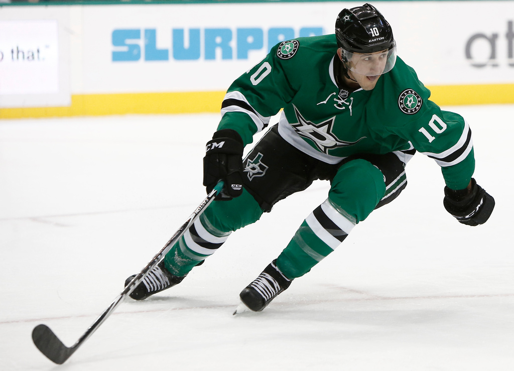 FILE - Dallas Stars forward Shawn Horcoff (10) pressures the New York Rangers defense during the first period of an NHL hockey game, Dec. 29, 2014, in Dallas. (AP Photo/Brandon Wade, File)