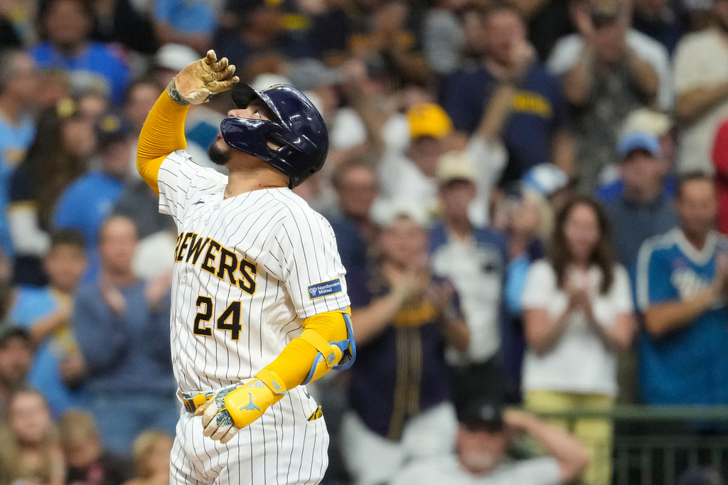 Milwaukee Brewers' William Contreras gestures as he rounds the bases after hitting a solo home run during the first inning of a baseball game against the Texas Rangers, Saturday, Aug. 29, 2026, in Milwaukee. (AP Photo/Aaron Gash)