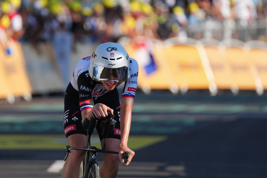 Slovenia's Tadej Pogacar of UAE Team Emirates XRG crosses the finish line of the first stage of the Tour de France cycling race, a team time-trial over 19.6 kilometers (11.8 miles) with start and finish in Barcelona, Spain, Saturday, July 4, 2026. (AP Photo/Thibault Camus)