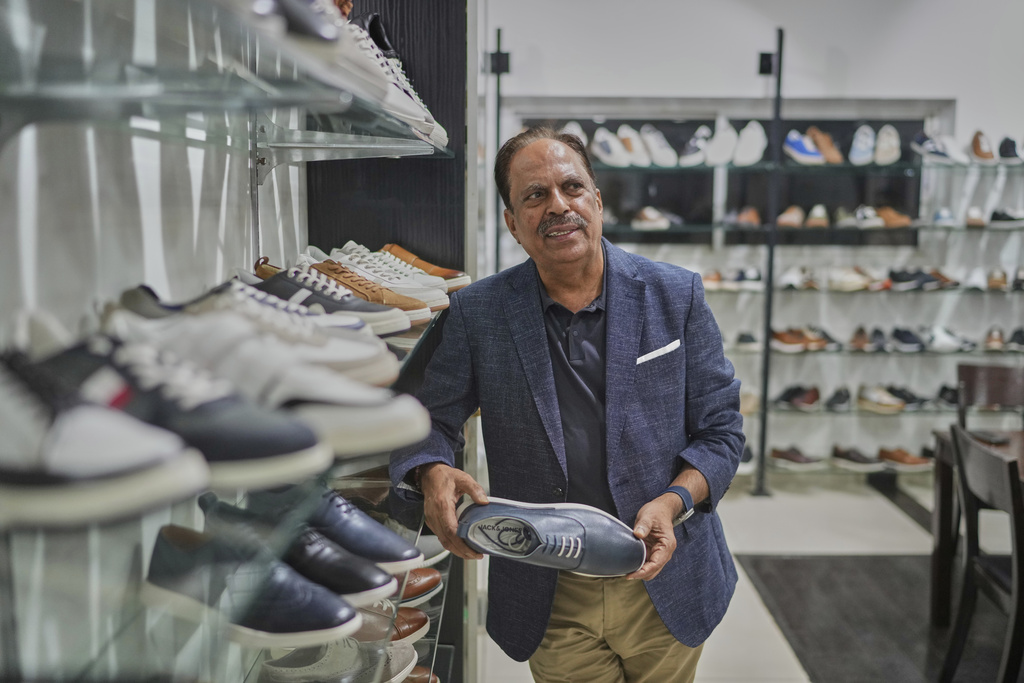 Puran Dawar, Chairman, Dawar group, ań exporter of leather footwear talks to The Associated Press, in Agra, India, Monday, Aug. 25, 2025. (AP Photo/Manish Swarup)