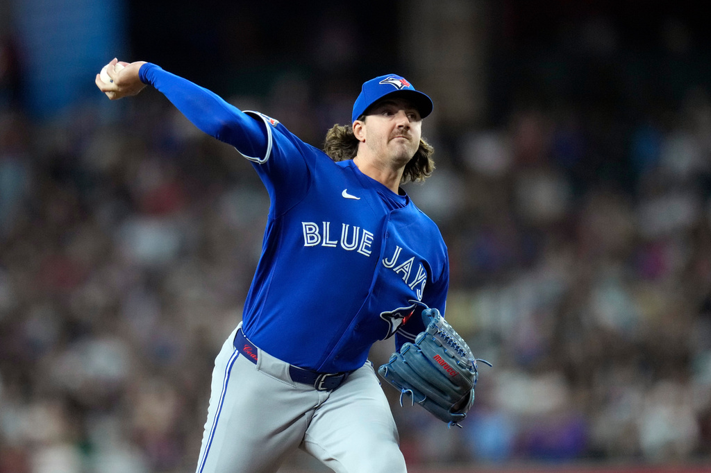 Toronto Blue Jays starting pitcher Kevin Gausman throws against the Arizona Diamondbacks during the first inning of a baseball game, Sunday, April 19, 2026, in Phoenix. (AP Photo/Ross D. Franklin)