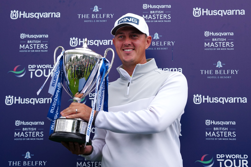 Winner Joe Dean of England poses with the trophy on day four of the British Masters at The Belfry Hotel & Resort, Sutton Coldfield, England, Sunday Aug. 30, 2026. (Bradley Collyer/PA via AP)