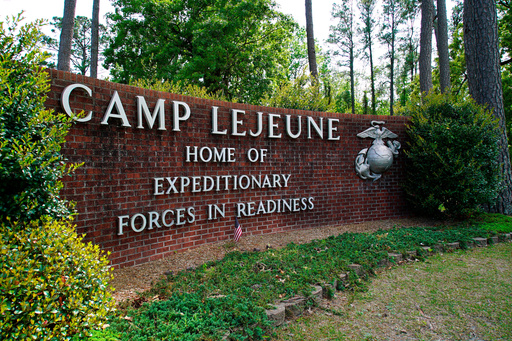 FILE - The main gate to Camp Lejeune Marine Base is seen outside Jacksonville, N.C., April 29, 2022. (AP Photo/Allen G. Breed, File) FILE - The main gate to Camp Lejeune Marine Base is seen outside Jacksonville, N.C., April 29, 2022. (AP Photo/Allen G. Breed, File)