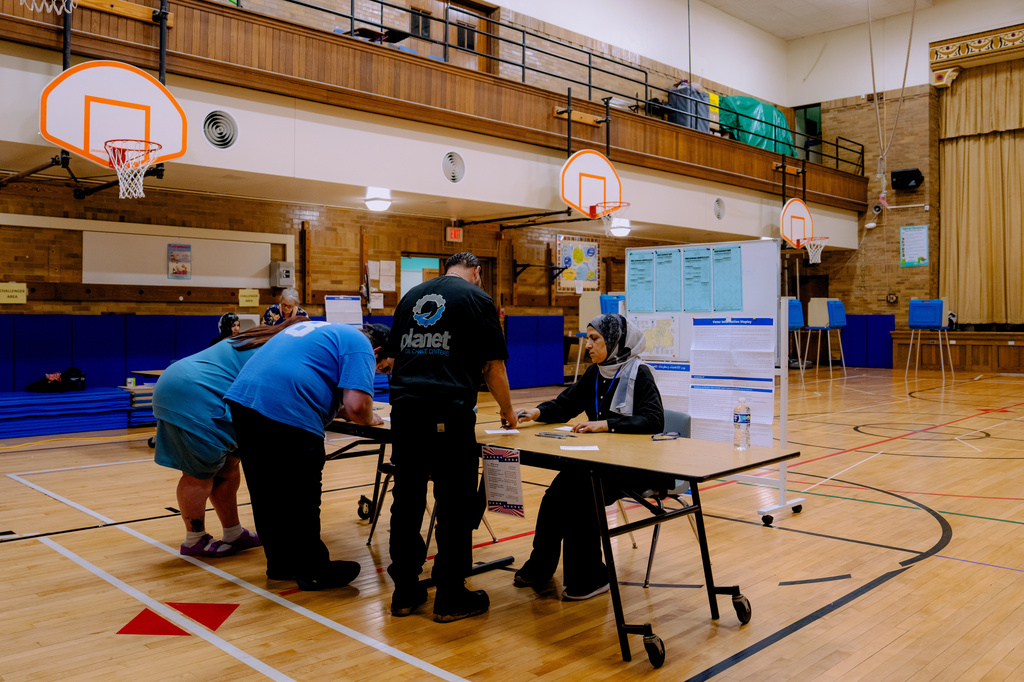 People prepare to vote at Oakman Elementary School on primary election day, Tuesday, Aug. 4, 2026, in Dearborn, Mich. (AP Photo/Nic Antaya) CORRECTION: Corrects location to Dearborn NOT Detroit